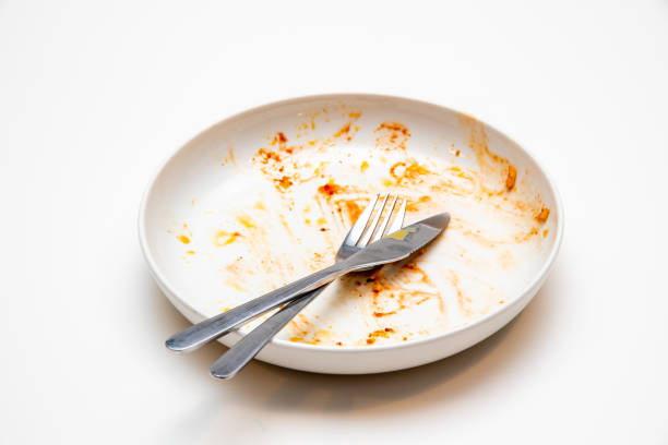 istock Dirty plate with fork and knife 1449905027