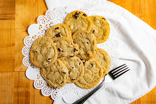 Chocolate chip cookies on the cream background. Sweet food biscuit concept.