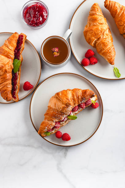 istock Croissant with fresh raspberries 1449920615