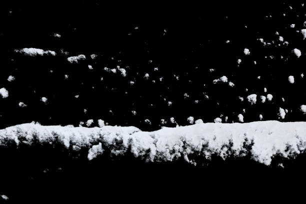 istock white snow isolated on a black background. Winter elements for design 1449923928