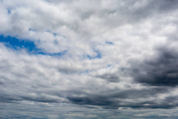 istock Beautiful clouds during spring time in a Sunny day. Blue sky and white fluffy clouds. 1449944196
