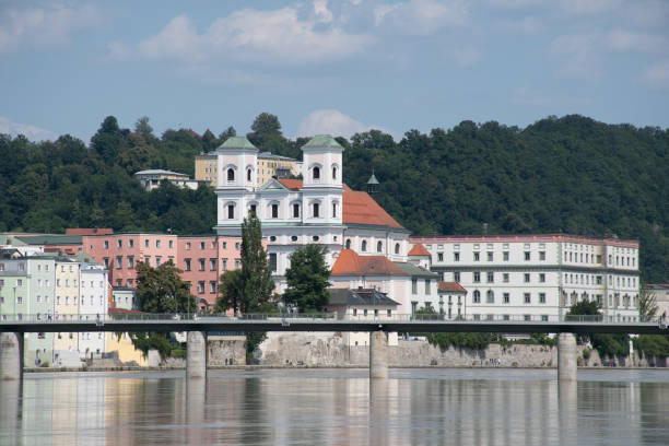Passau, Germany - July 22, 2021: St. Michael's Church and the river Inn.