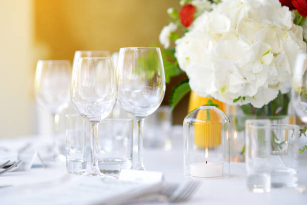 istock Beautiful table setting with crockery and flowers for a party, wedding reception or other festive event 1449951418