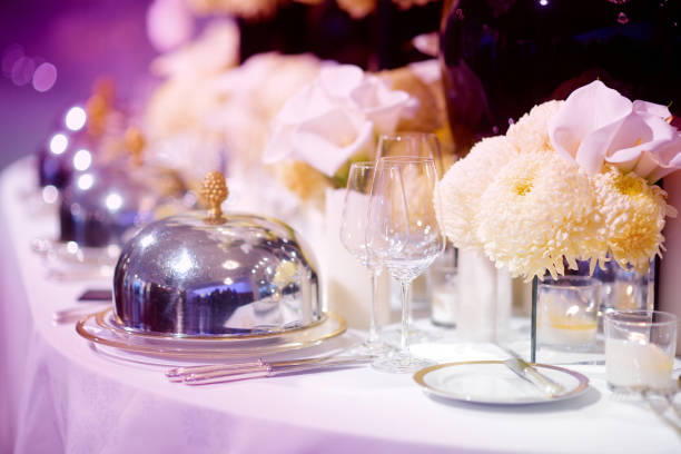 istock Beautiful table setting with crockery and flowers for a party, wedding reception or other festive event 1449952056