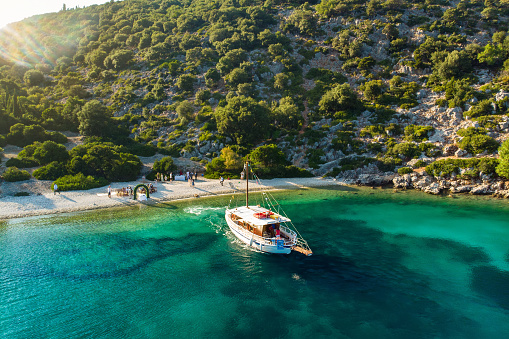 Destination wedding on a beach. Scenic aerial view of picturesque jagged coastline of Kefalonia with clear turquoise waters. Cephalonia, Ionian islands, Greece.
