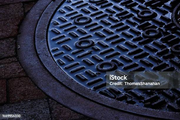 Water Filled Manhole Cover Stock Photo - Download Image Now - Manhole, Water, Abstract