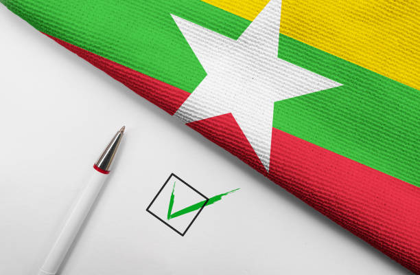 pencil, flag of Myanmar and check mark on paper sheet