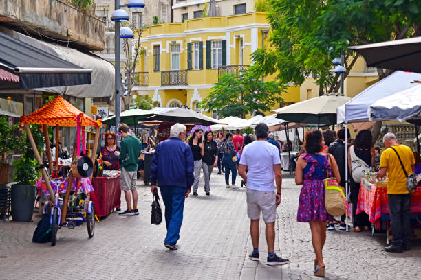 Israeli people shopping at Nachalat Binyamin Art Fair Market in Tel Aviv Israel stock photo