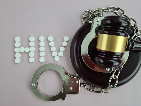 Judicial gavel and word hiv. Symbol of the fight against AIDS concept