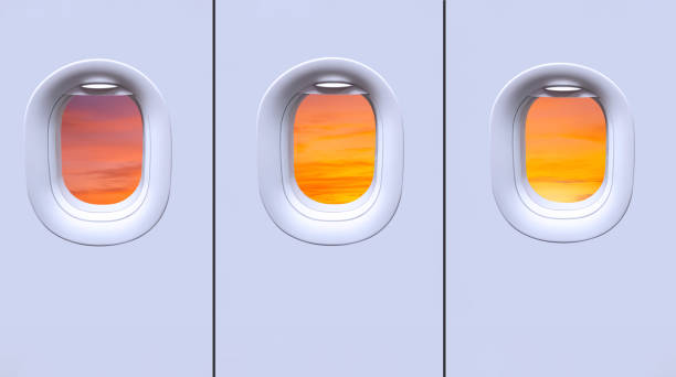 istock Beautiful sunset sky view inside of 3 windows on white wall in airplane 1449976361