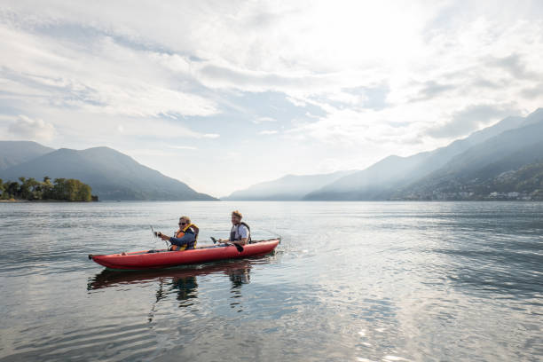 istock Father and son canoeing on tranquil lake 1449976857
