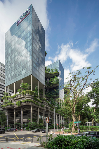 Vertical garden building in the middle of a cross junction road in the morning on 2 December 2022