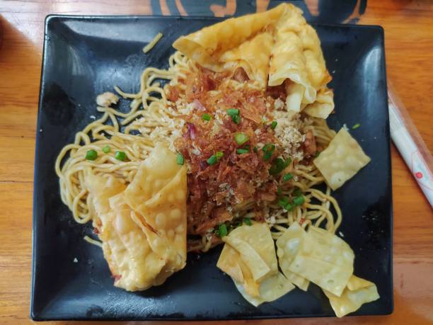 istock Spicy noodles on the black plate. 1449980911