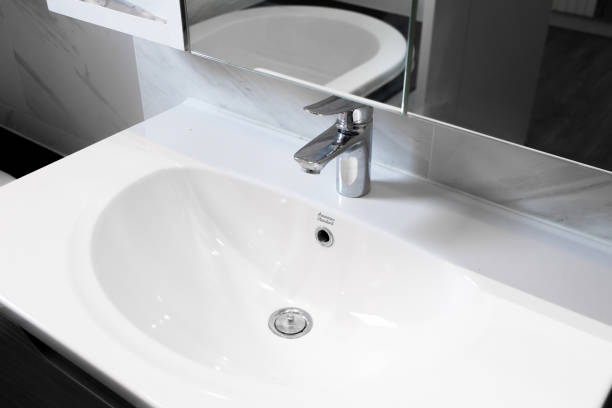 istock Close-up small basin in bathroom, On white ceramic wall. 1449999029