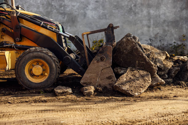 istock An excavator removing rocks and asphalt from the road. 1450003494