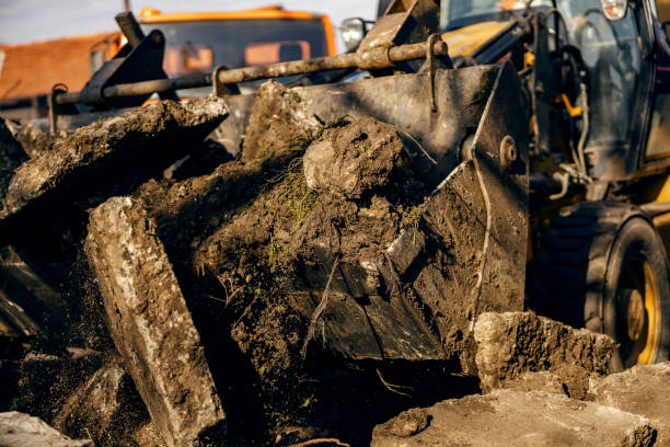 istock Close up of excavator removing asphalt from construction site. 1450003576