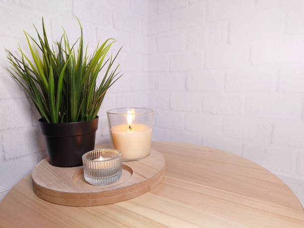 istock Decorative grass and burning candles on the podium 1450004884