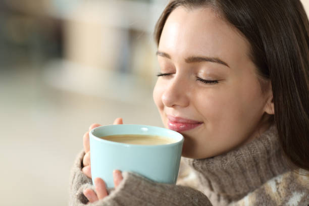 istock Teen smelling coffee at home 1450005517
