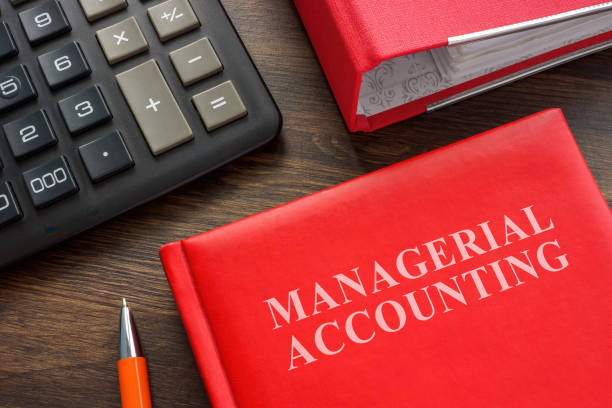 istock Book with Managerial accounting info, calculator and folder. 1450012557
