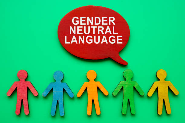 istock Gender neutral language inscription and colorful figurines. 1450013120