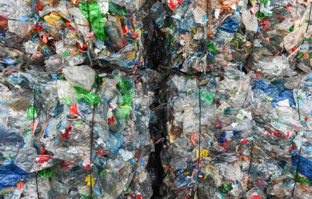 Close-up of a pile of compressed plastic waste bottles bundled for recycling stock photo