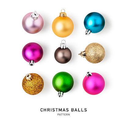 Christmas baubles, colorful balls pattern and creative layout isolated on white background. Design element. Holiday decoration. Flat lay, top view