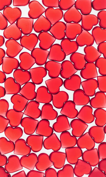 istock Valentines day concept many little hearts form red kbackground 1450018196