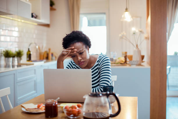 istock Young adult woman using a laptop 1450019512