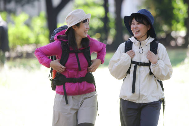 Group of mature women walking and exploring the forest.