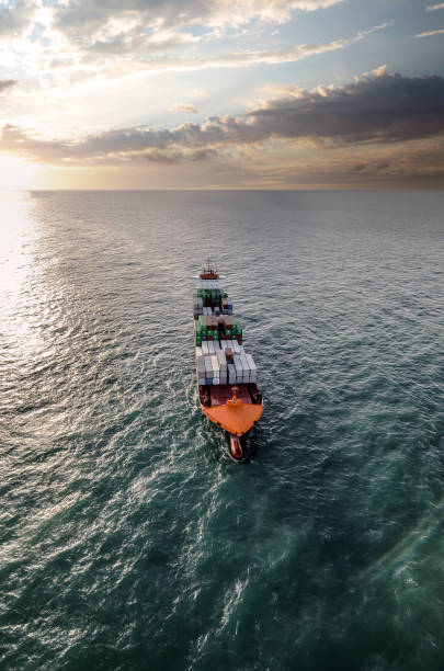 istock Impressive aerial wide angle view of a container ship crossing the oceans 1450021039