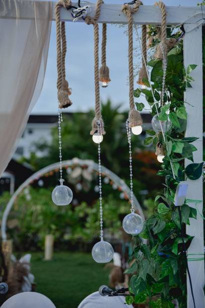 istock Low-angle view of a wooden post decorated with beautiful hanging lights 1450021173