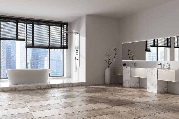 istock Corner view on bright bathroom interior with bathtub, shower 1450022472