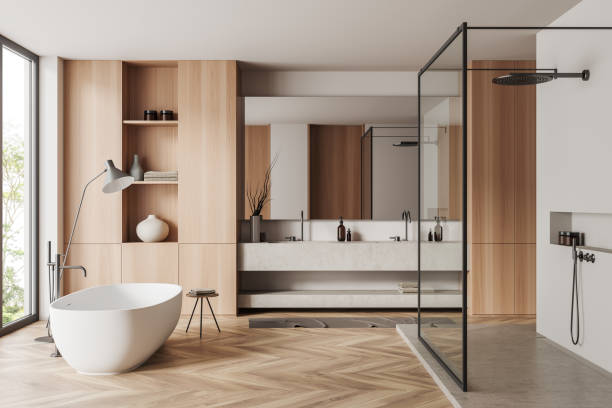 istock Light bathroom interior with sink and tub, douche and panoramic window 1450023085