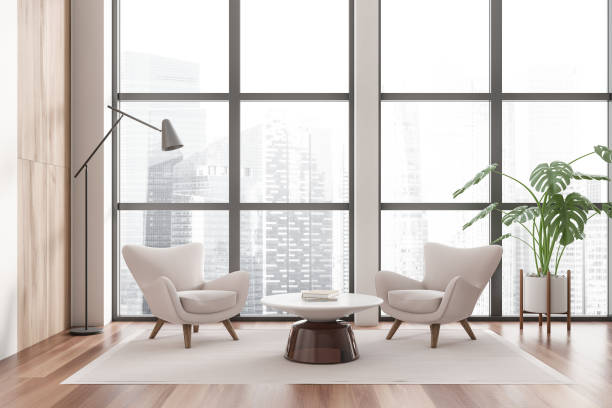 istock Light chill room interior with two seats and coffee table, panoramic window 1450023303