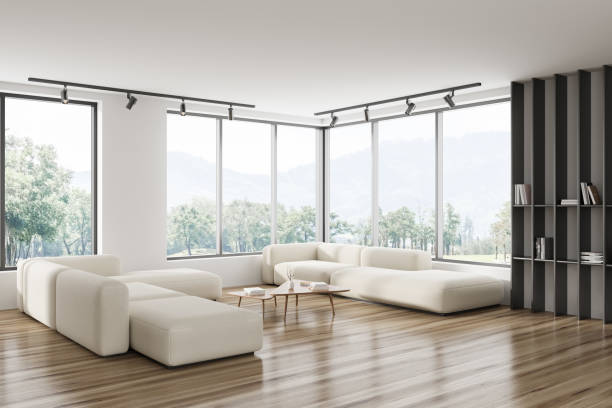 istock Light living room interior with soft place and shelf, panoramic window 1450023378