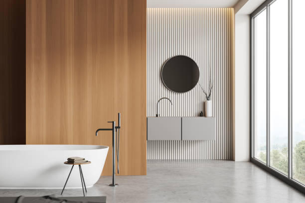 istock Front view on bright bathroom interior with sink, bathtub 1450023439
