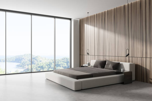 istock Stylish bedroom interior with bed near panoramic window. Empty wall 1450023639
