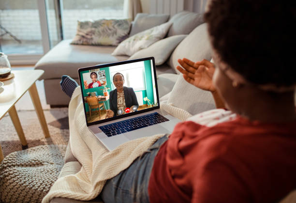 Young woman talking to her therapist online Close up of a young woman talking to her therapist online melancholy computer support specialist stock pictures, royalty-free photos & images