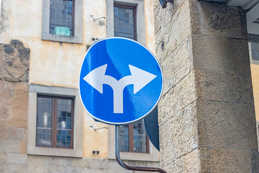 Split Arrow Road Sign at Florence in Tuscany, Italy