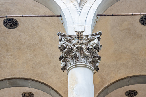 Classic architectural column. Details of the architecture of a historical building. Element of exterior building with columns and Stucco molding on the ceiling of Cathedral in St. Petersburg, Russia.