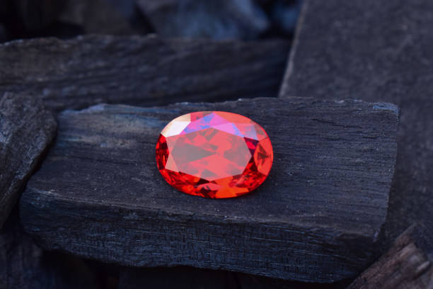 istock ruby Is a beautiful red gemstone on a wooden floor 1450029353