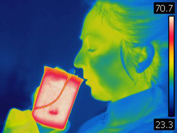 istock Thermal image of woman drinking hot tea 1450029429