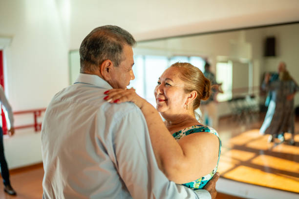 istock Senior couple dancing at dance studio 1450033777