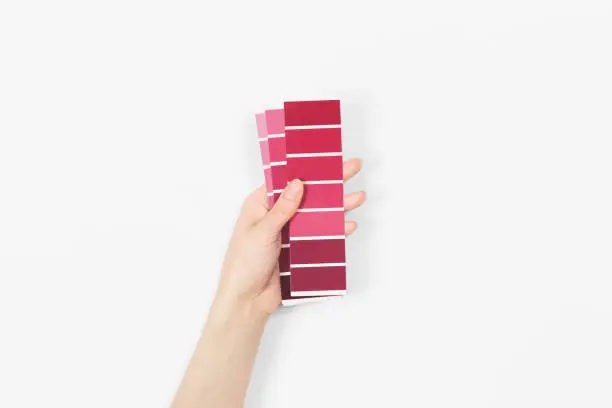 Photo of Color swatches with color of the year 2023 - Viva Magenta. Color trend palette. Top view, flat lay.