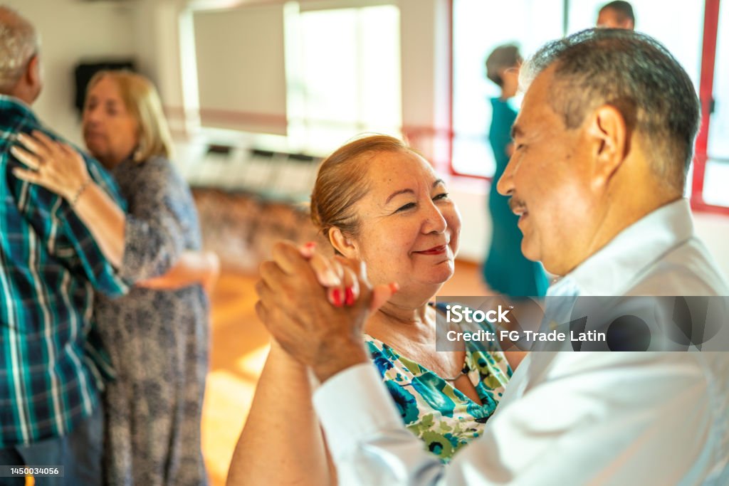Senior couple dancing at dance studio 55-59 Years Stock Photo