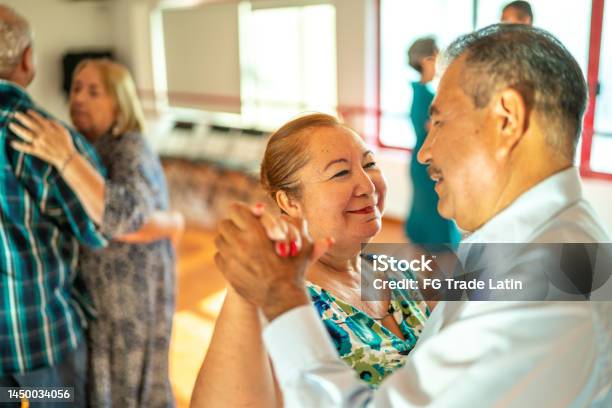 Senior Couple Dancing At Dance Studio Stock Photo - Download Image Now - 55-59 Years, Active Lifestyle, Active Seniors
