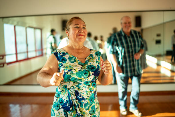 istock Mature woman dancing at dance studio 1450035282