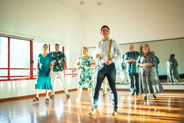 istock Dancing teacher with senior couple at a dancing class 1450035351