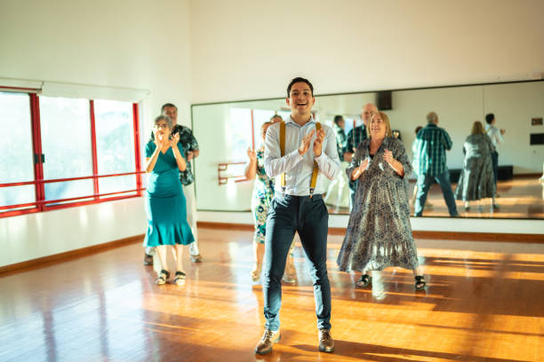 istock Dancing teacher with senior couple at a dancing class 1450035355