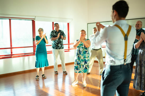 istock Dancing teacher with senior couple at a dancing class 1450035363